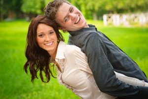 playful happy couple in a park